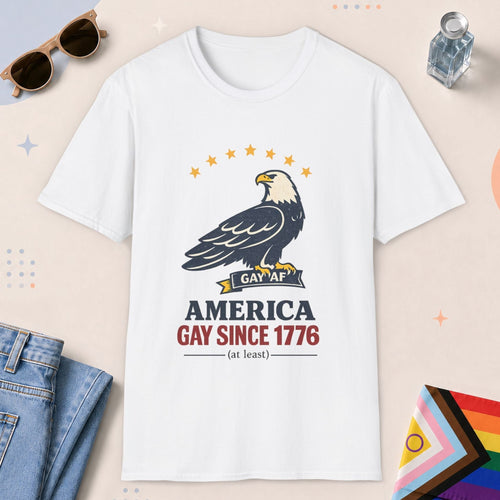White color all-gender graphic t-shirt with "America Gay Since 1776" design