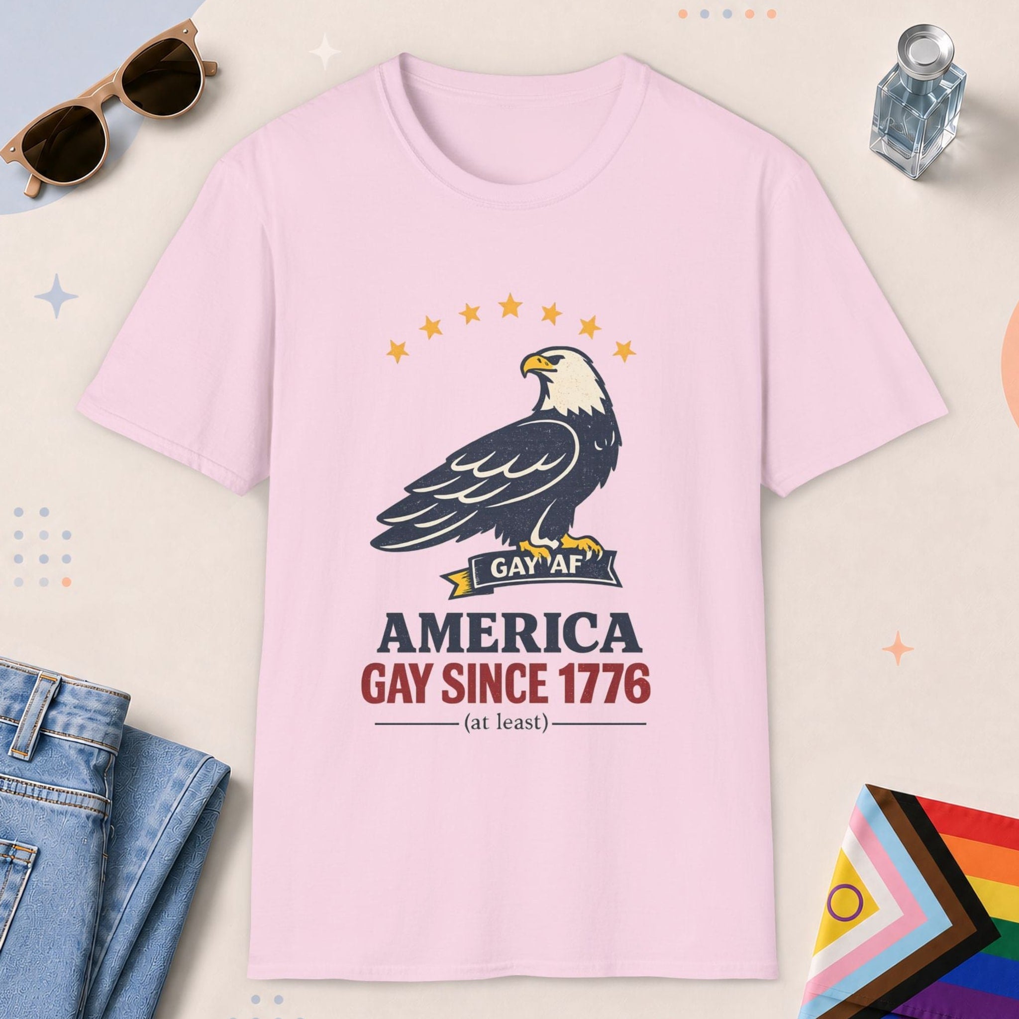 Light Pink color all-gender graphic t-shirt with "America Gay Since 1776" design
