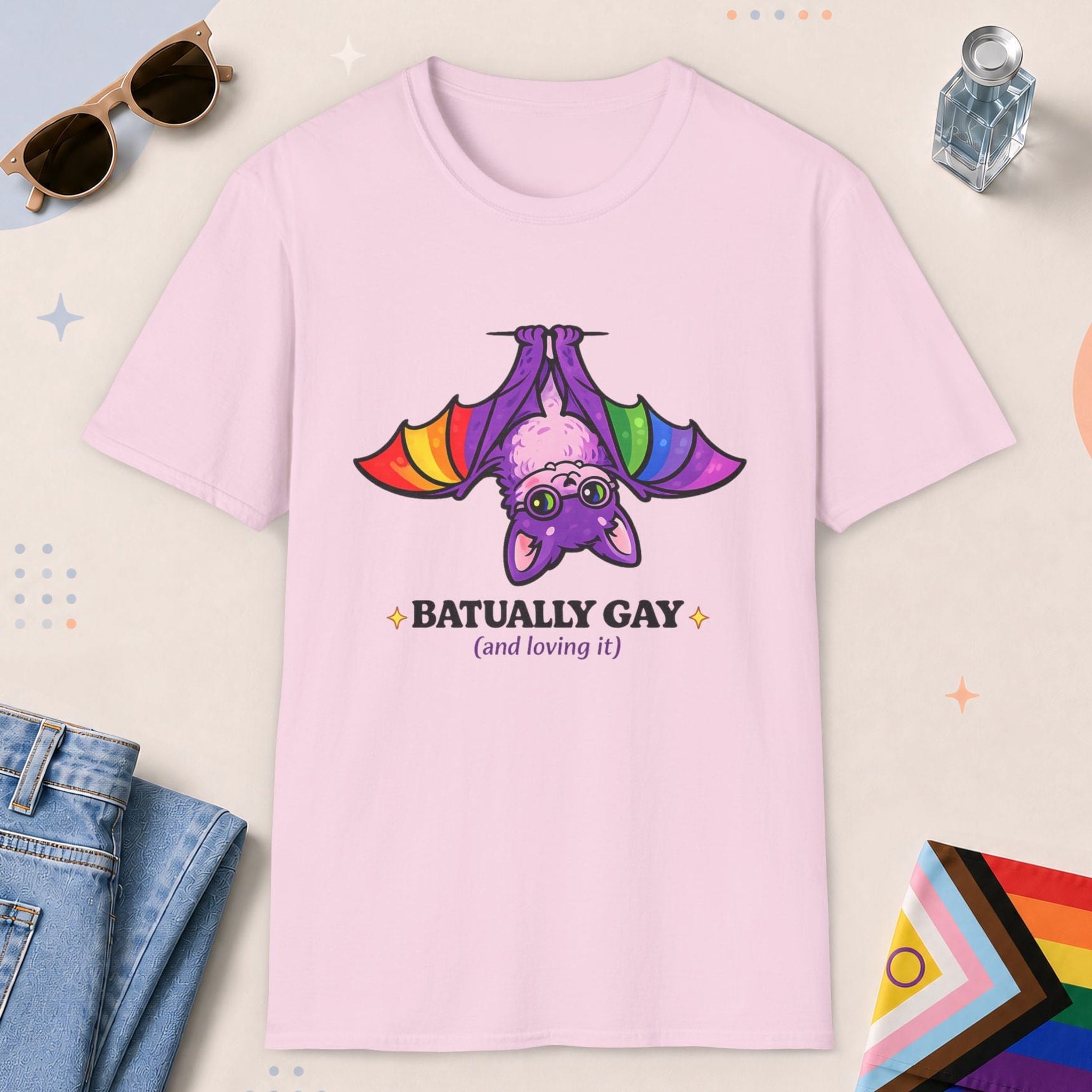 Light Pink color all-gender graphic t-shirt with "Batually Gay" design