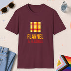 Maroon color all-gender graphic t-shirt with "Flannel & Feelings" design