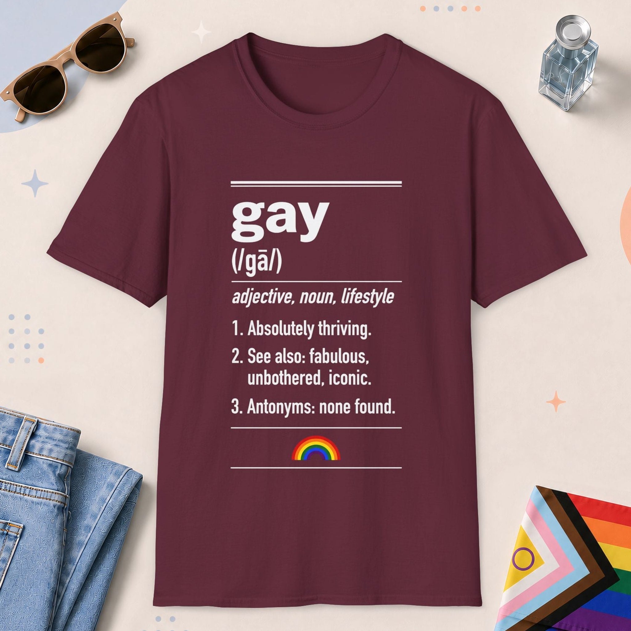 Maroon color all-gender graphic t-shirt with "Gay Definition" design