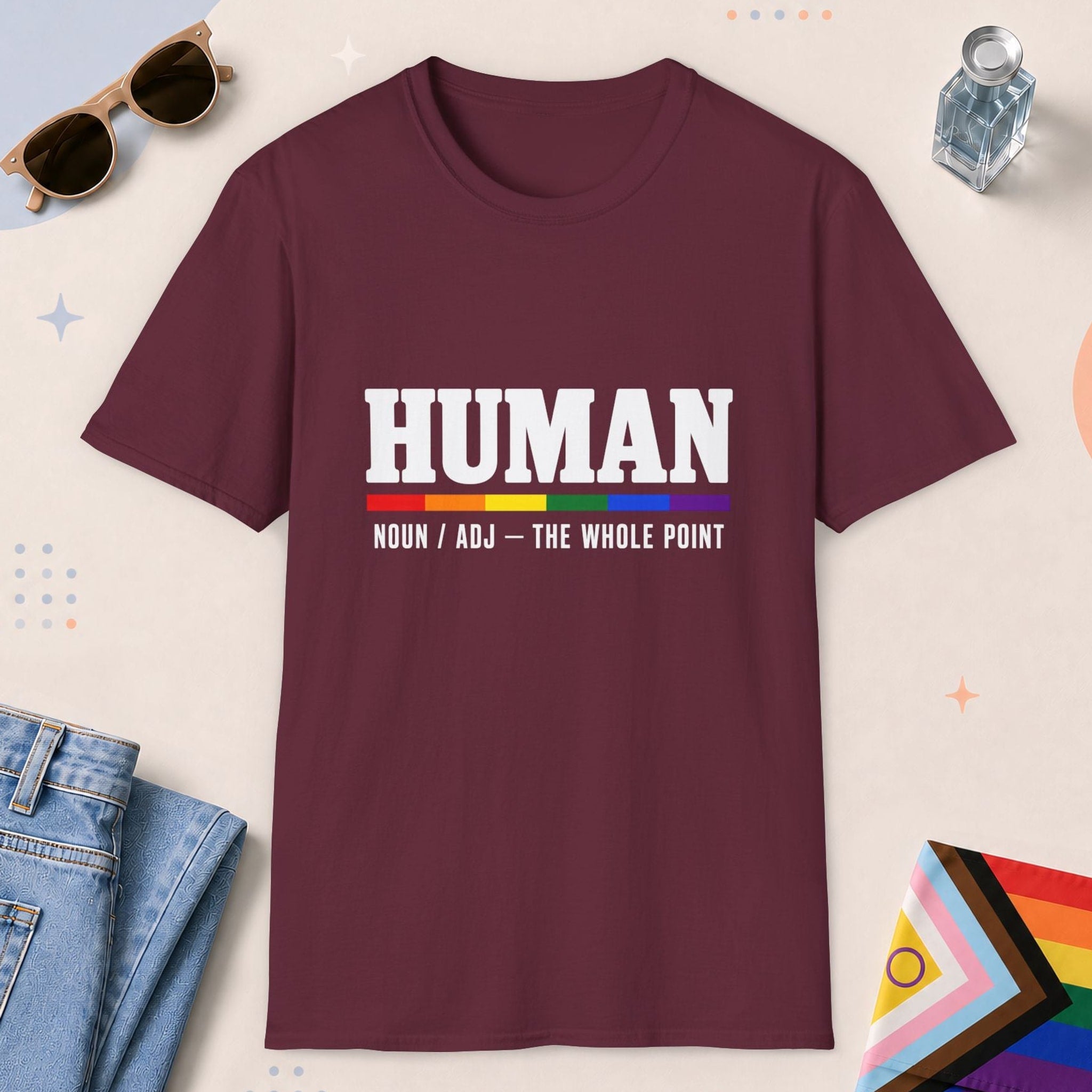 Maroon color all-gender graphic t-shirt with "Human" design