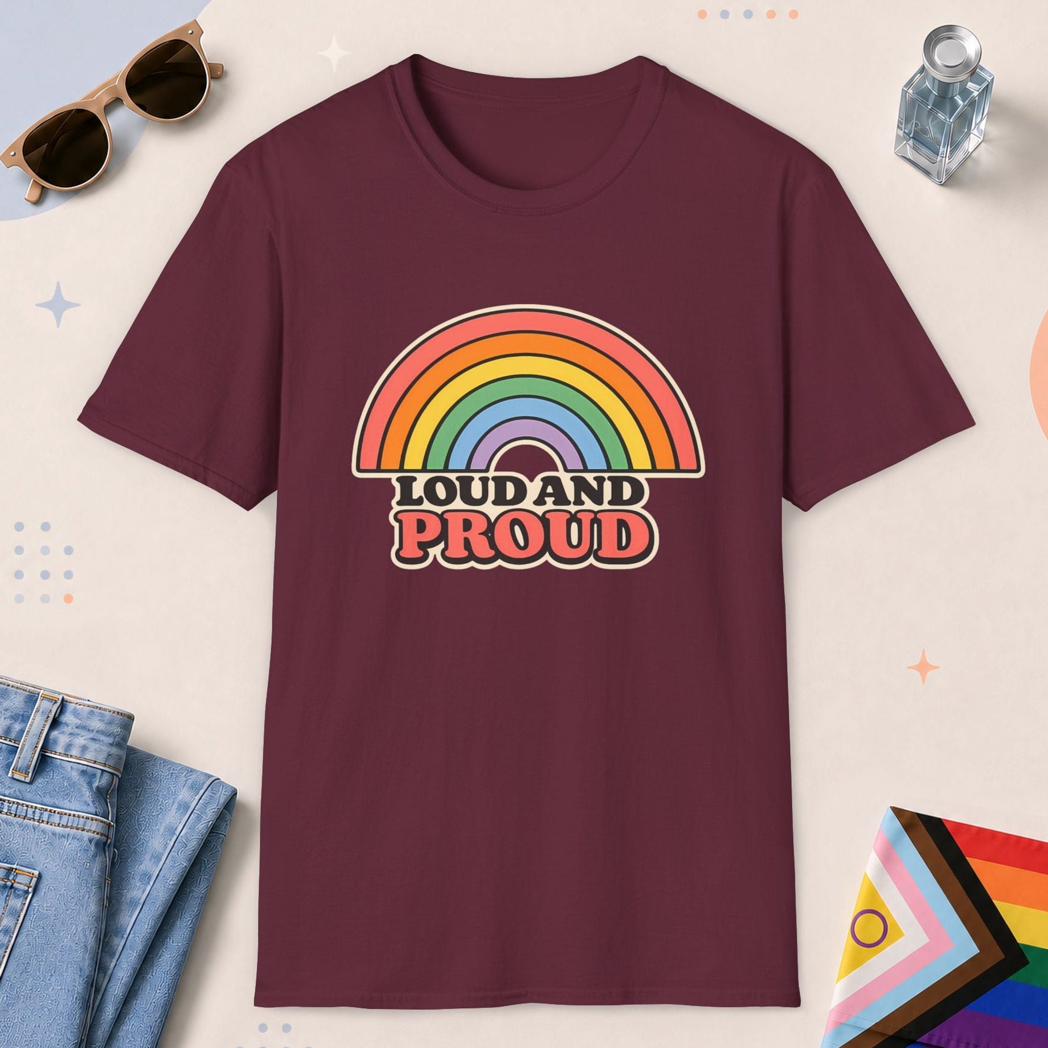 Maroon color all-gender graphic t-shirt with "Loud And Proud" design