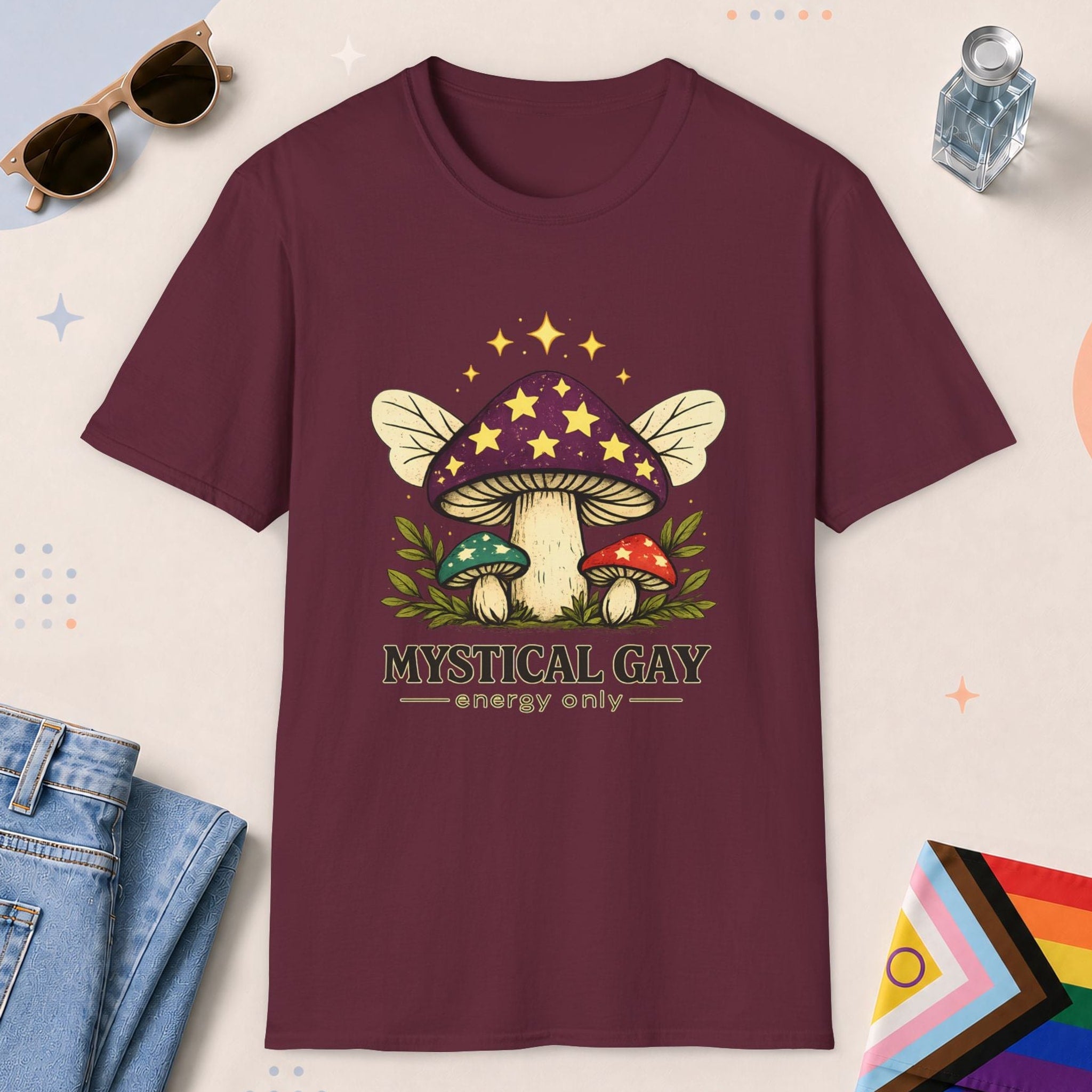 Maroon color all-gender graphic t-shirt with "Mystical Gay Energy" design
