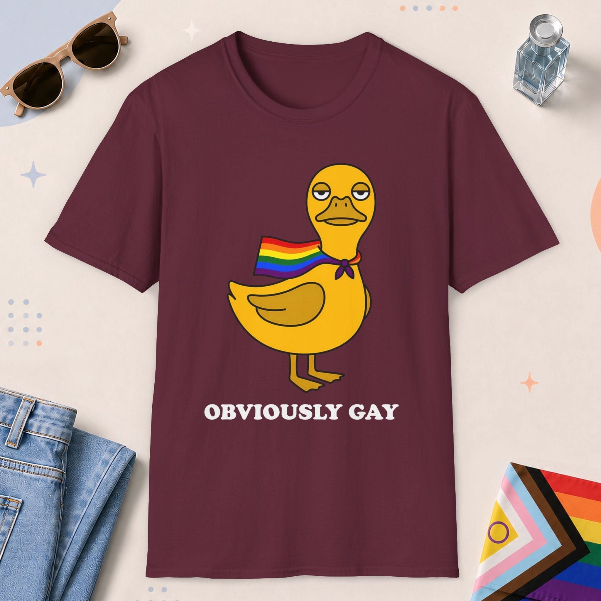 Maroon color all-gender graphic t-shirt with "Obviously Gay Duck" design