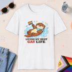 White color all-gender graphic t-shirt with "Otter Living Best Gay Life" design