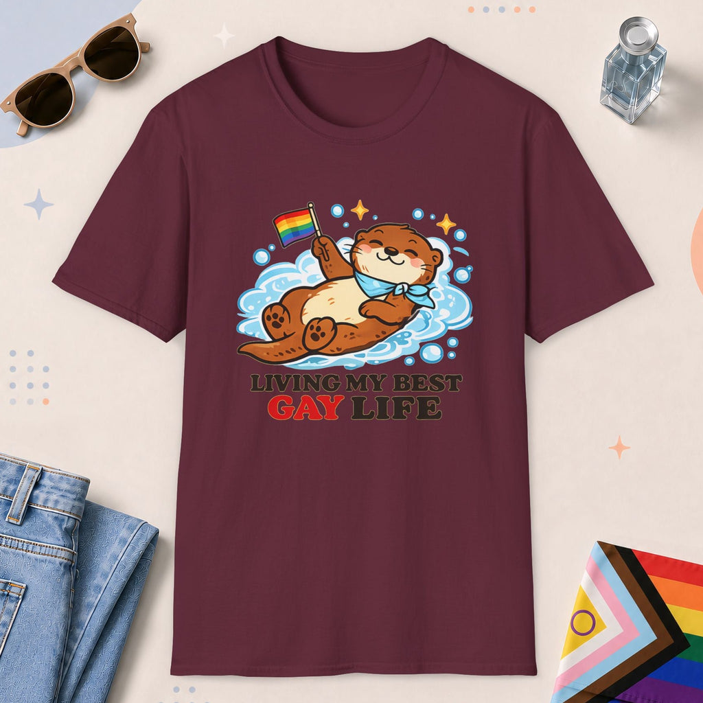 Maroon color all-gender graphic t-shirt with "Otter Living Best Gay Life" design