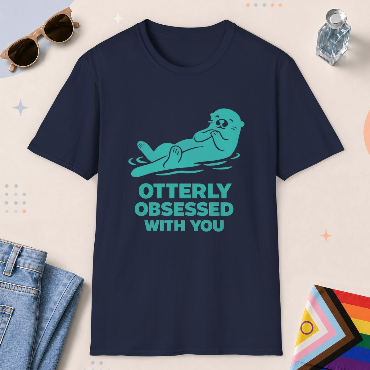 Navy color all-gender graphic t-shirt with "Otterly Obsessed" design