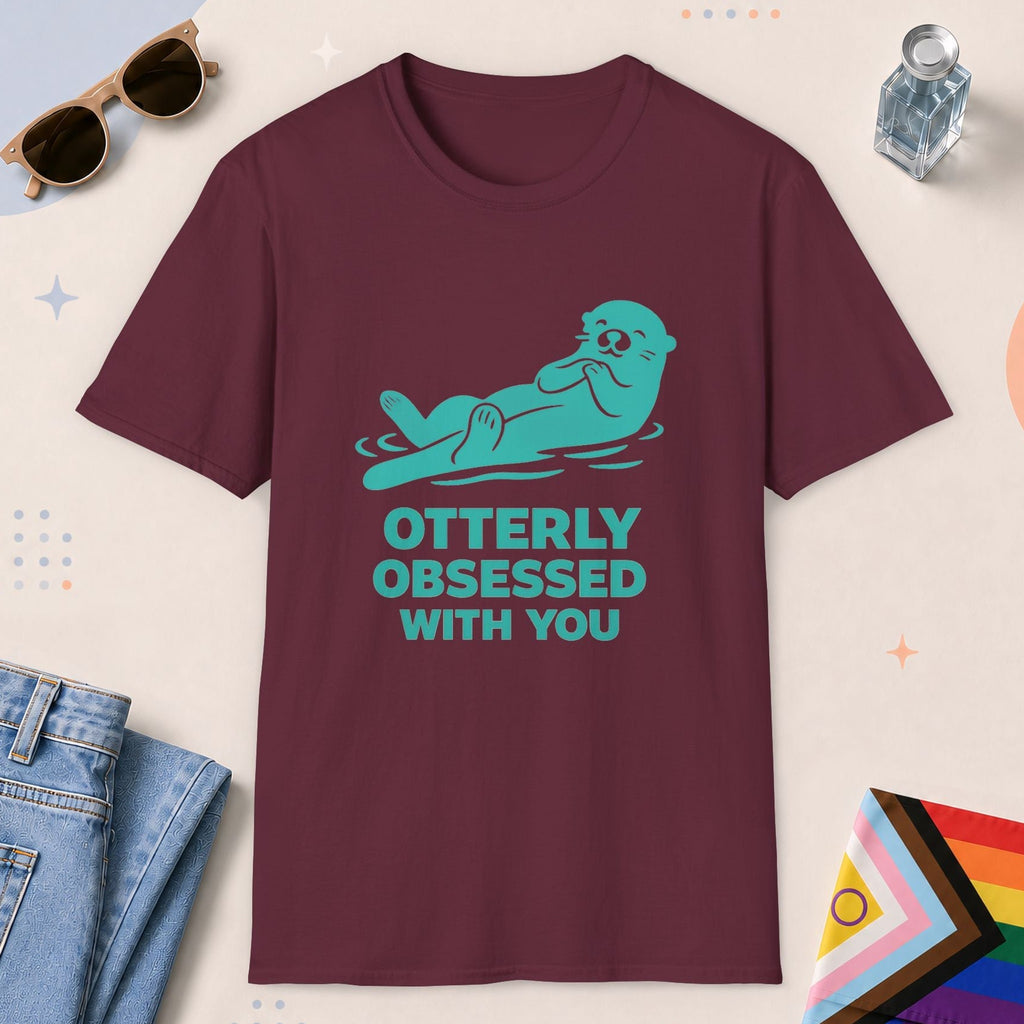 Maroon color all-gender graphic t-shirt with "Otterly Obsessed" design