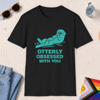 Black color all-gender graphic t-shirt with "Otterly Obsessed" design