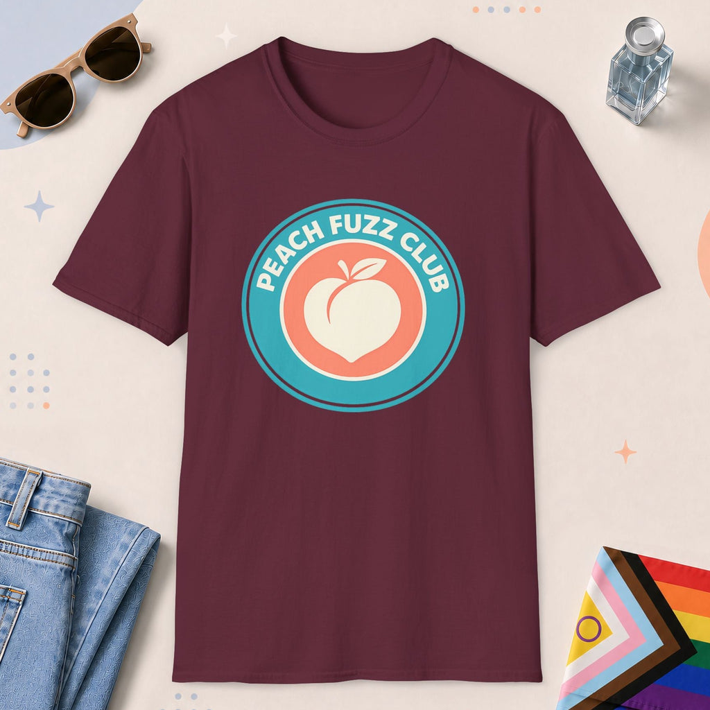 Maroon color all-gender graphic t-shirt with "Peach Fuzz Club" design