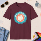 Maroon color all-gender graphic t-shirt with "Peach Fuzz Club" design