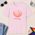 Light Pink color all-gender graphic t-shirt with "Peachy" design