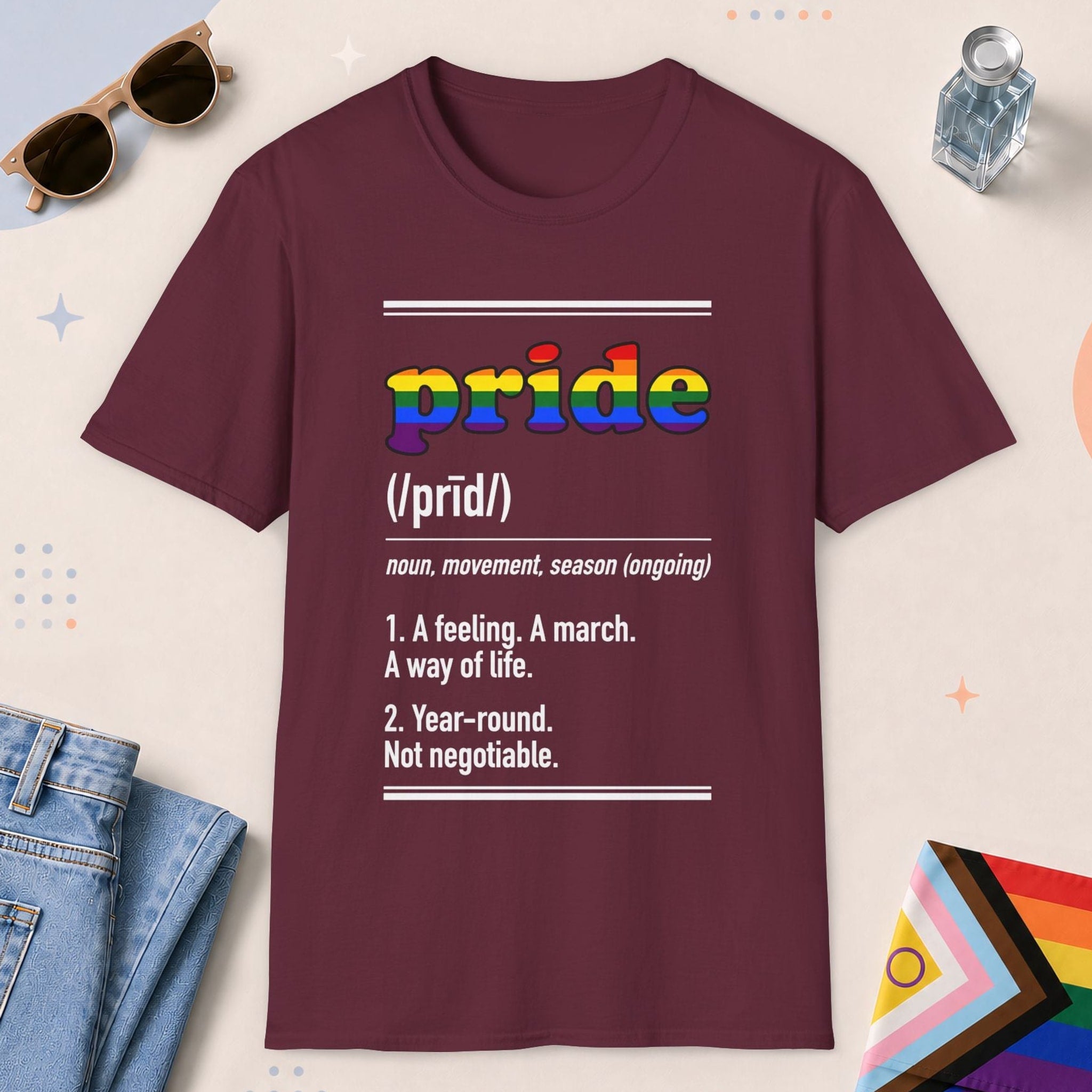 Maroon color all-gender graphic t-shirt with "Pride Definition" design