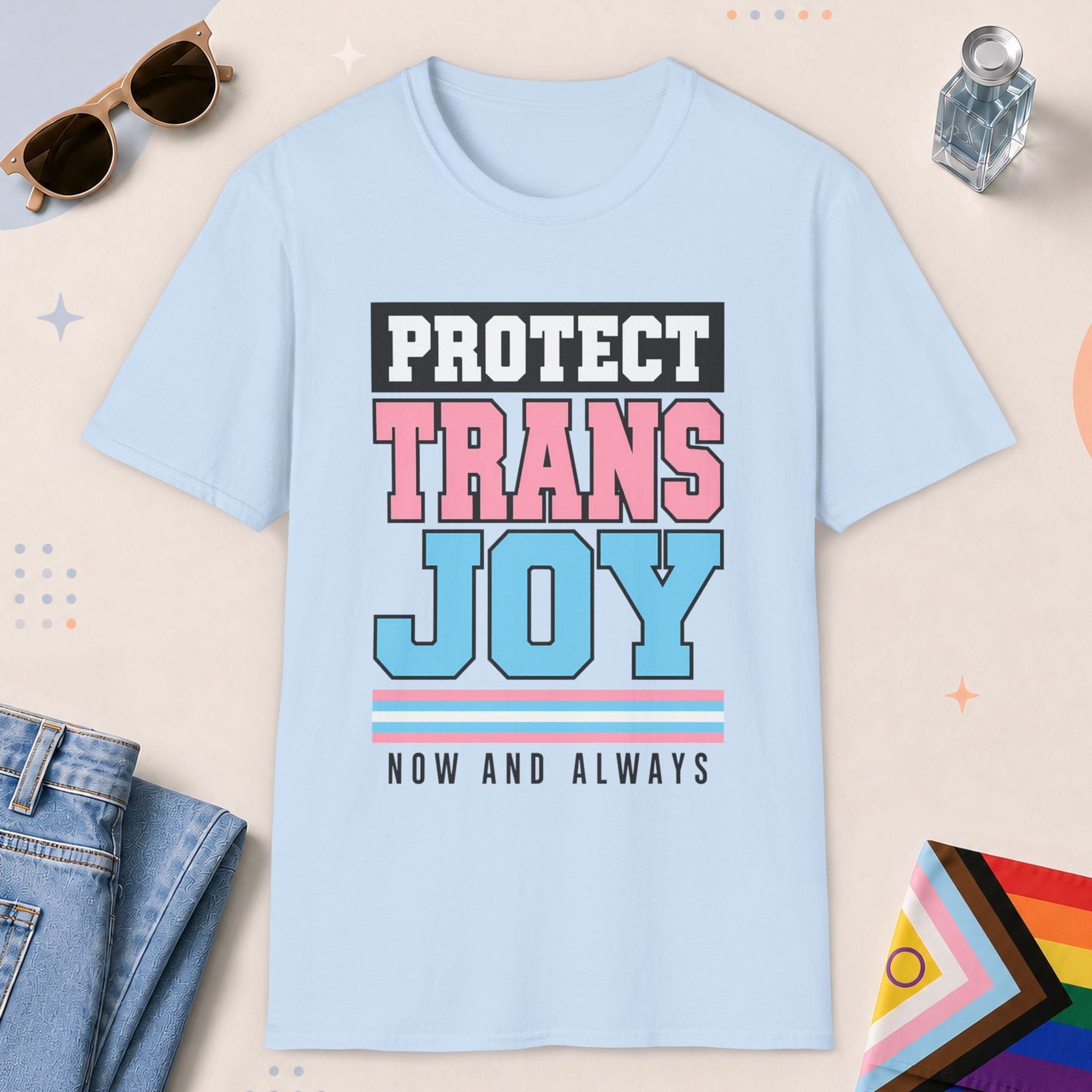 Light Blue color all-gender graphic t-shirt with "Protect Trans Joy" design
