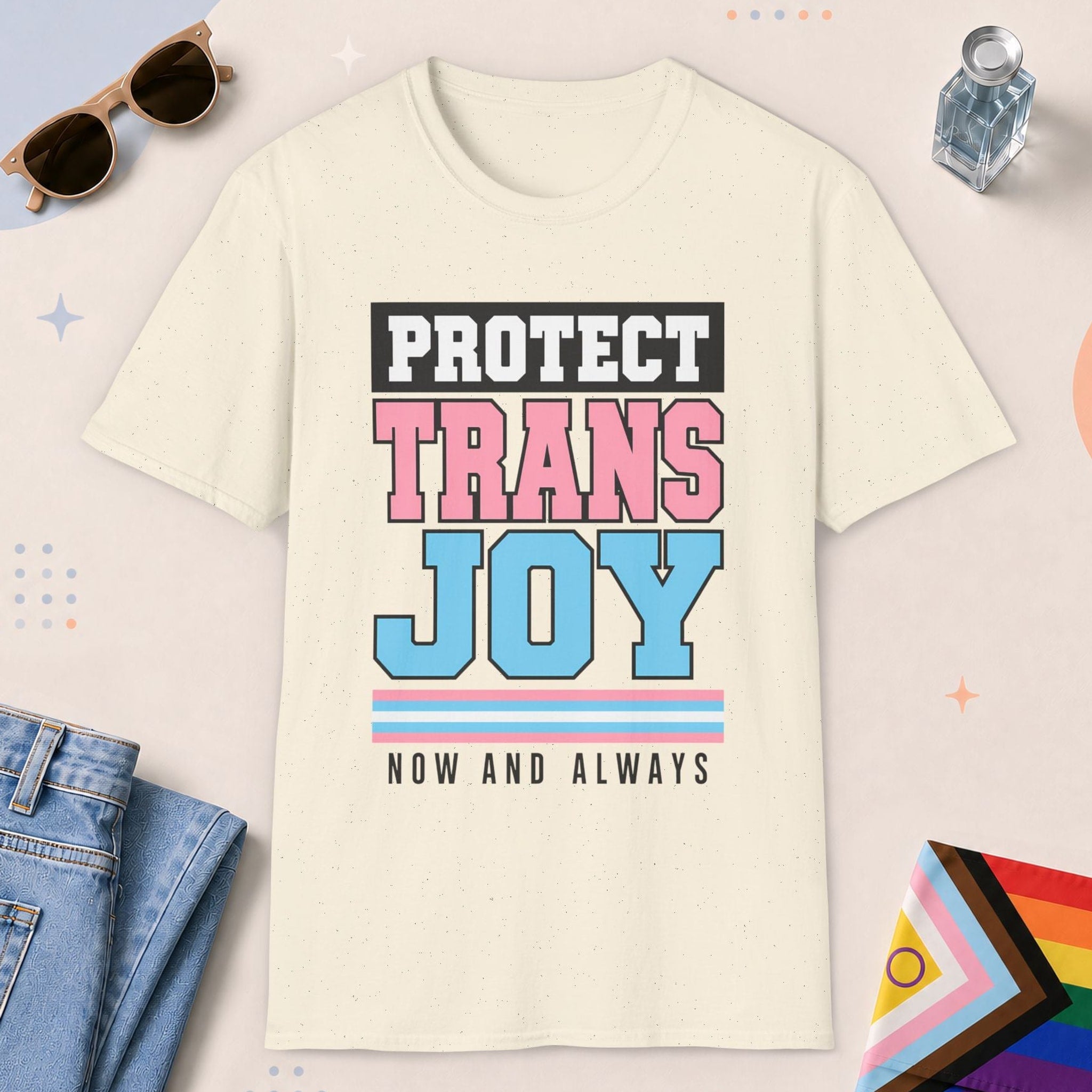 Natural color all-gender graphic t-shirt with "Protect Trans Joy" design