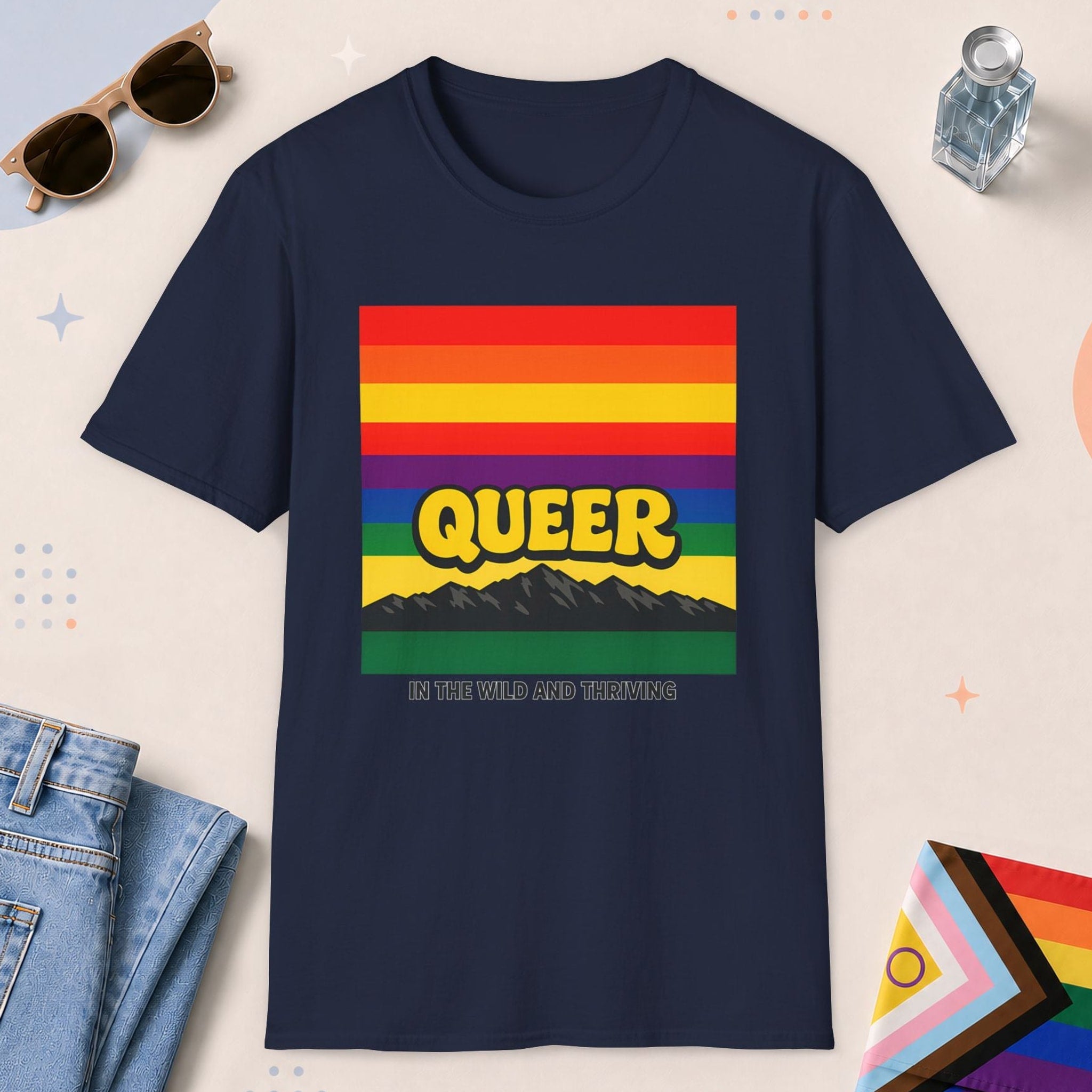 Navy color all-gender graphic t-shirt with "Queer In The Wild" design