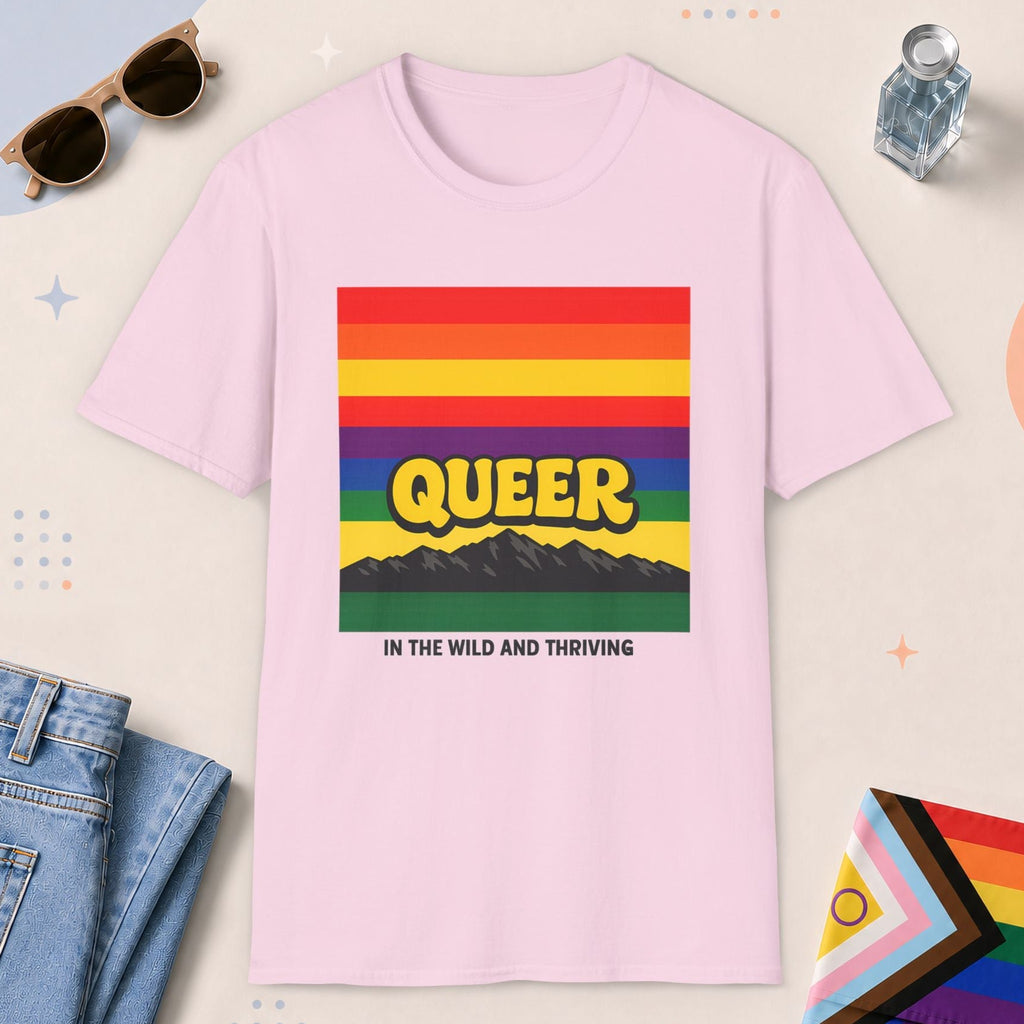 Light Pink color all-gender graphic t-shirt with "Queer In The Wild" design