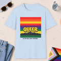 Light Blue color all-gender graphic t-shirt with "Queer In The Wild" design