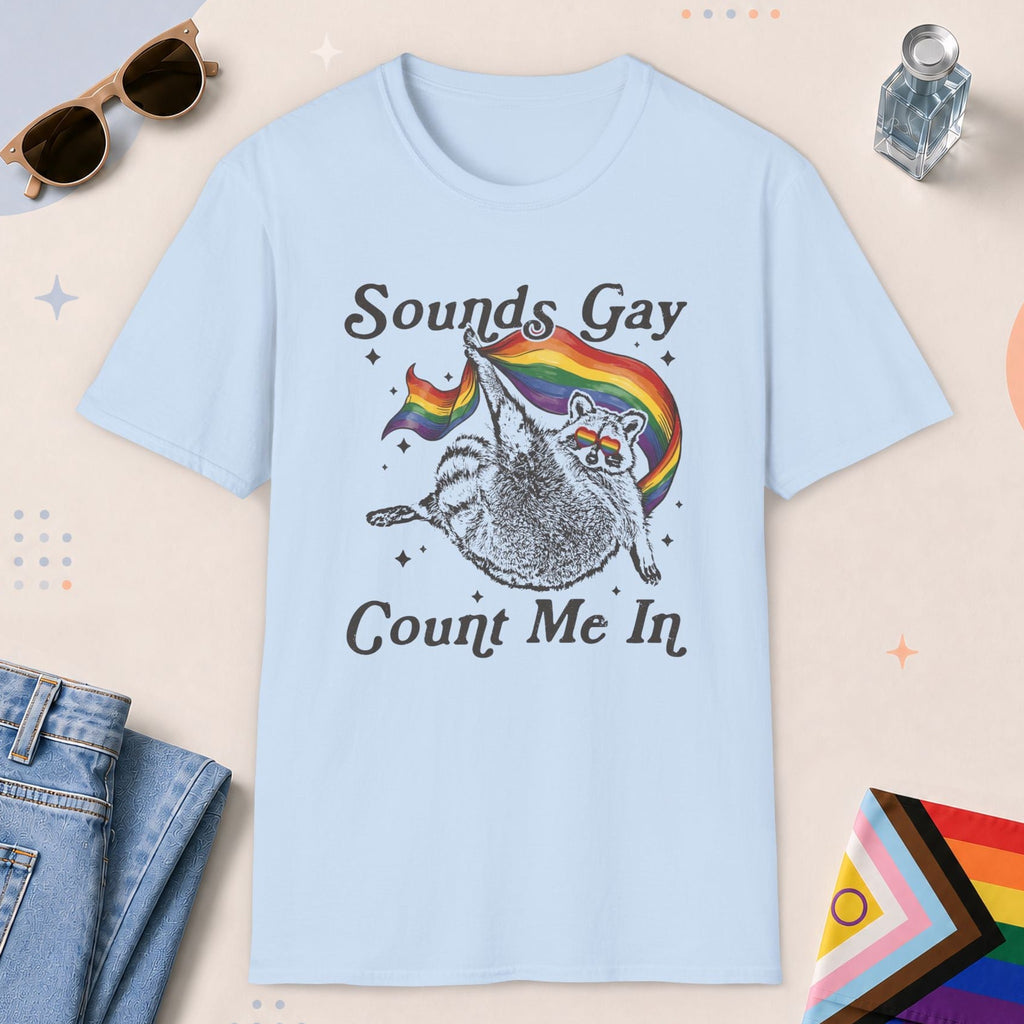 Light Blue color all-gender graphic t-shirt with "Sounds Gay Raccoon" design