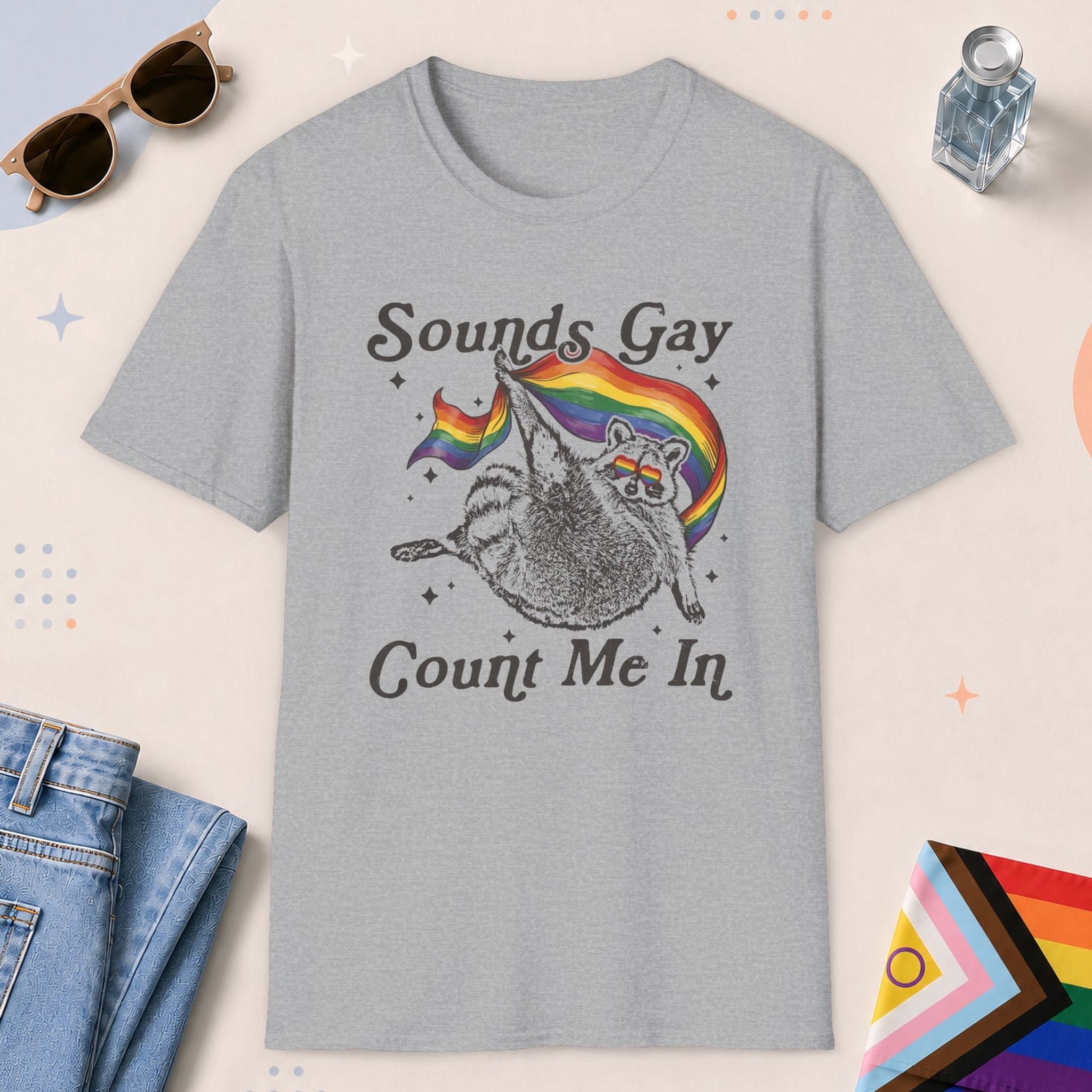 Sport Grey color all-gender graphic t-shirt with "Sounds Gay Raccoon" design
