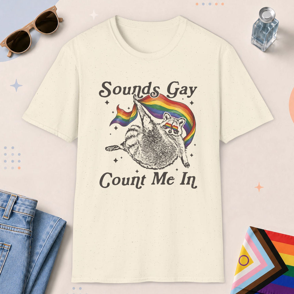 Natural color all-gender graphic t-shirt with "Sounds Gay Raccoon" design
