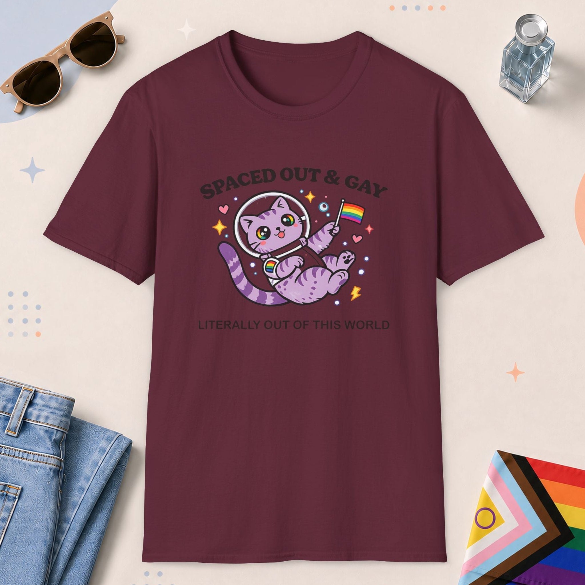 Maroon color all-gender graphic t-shirt with "Spaced Out Cat" design