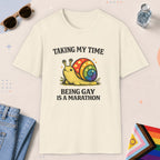 Natural color all-gender graphic t-shirt with "Taking My Time Snail" design