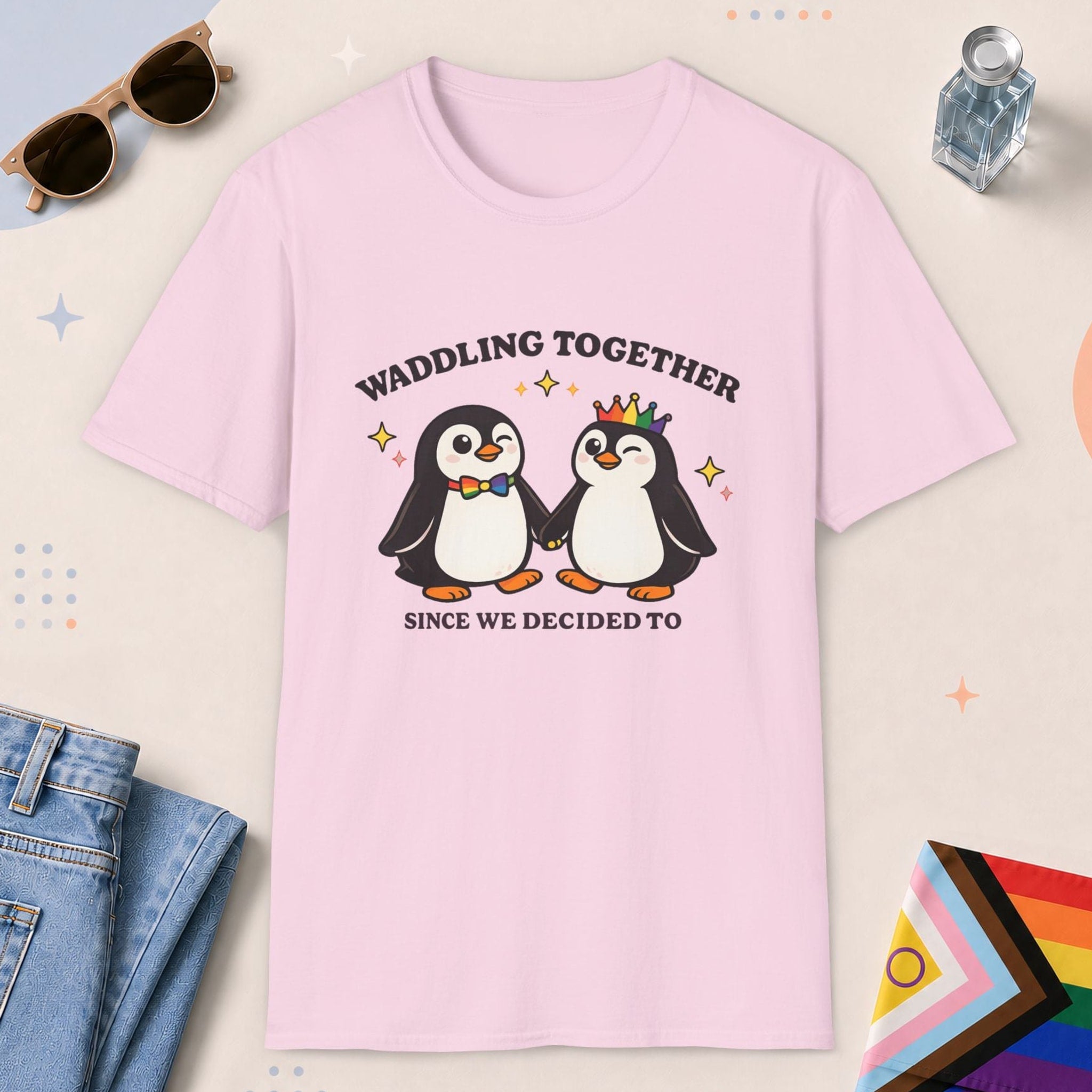 Light Pink color all-gender graphic t-shirt with "Waddling Together" design