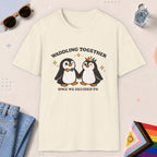 Natural color all-gender graphic t-shirt with "Waddling Together" design