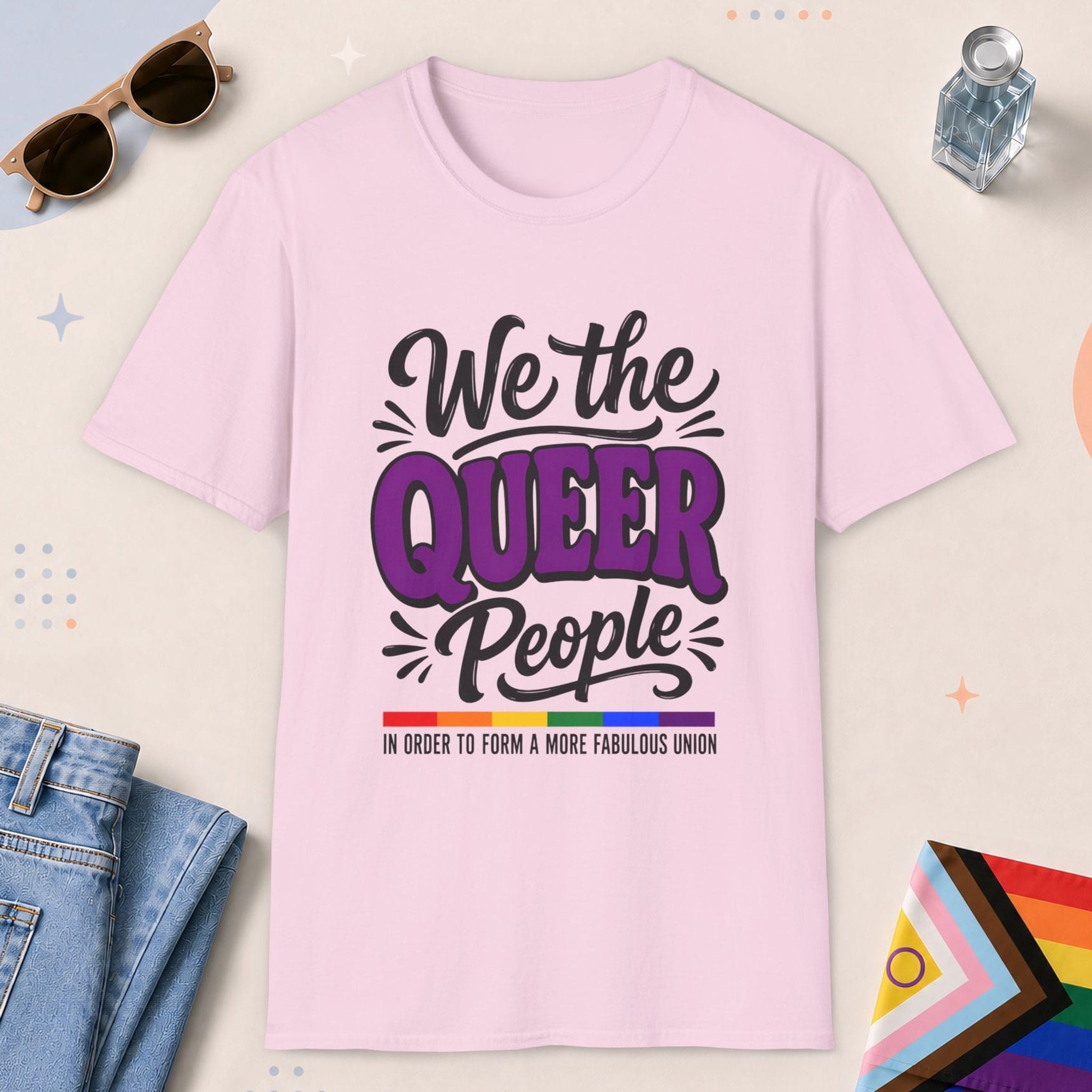 Light Pink color all-gender graphic t-shirt with "We The Queer People" design