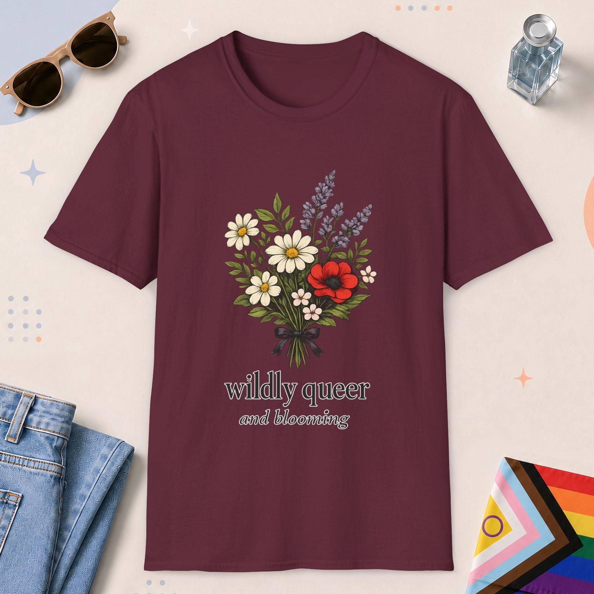 Maroon color all-gender graphic t-shirt with "Wildly Queer" design